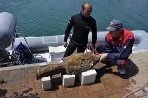 Police Commander pulls up a large artifact from a Roman wreck near Varazze.